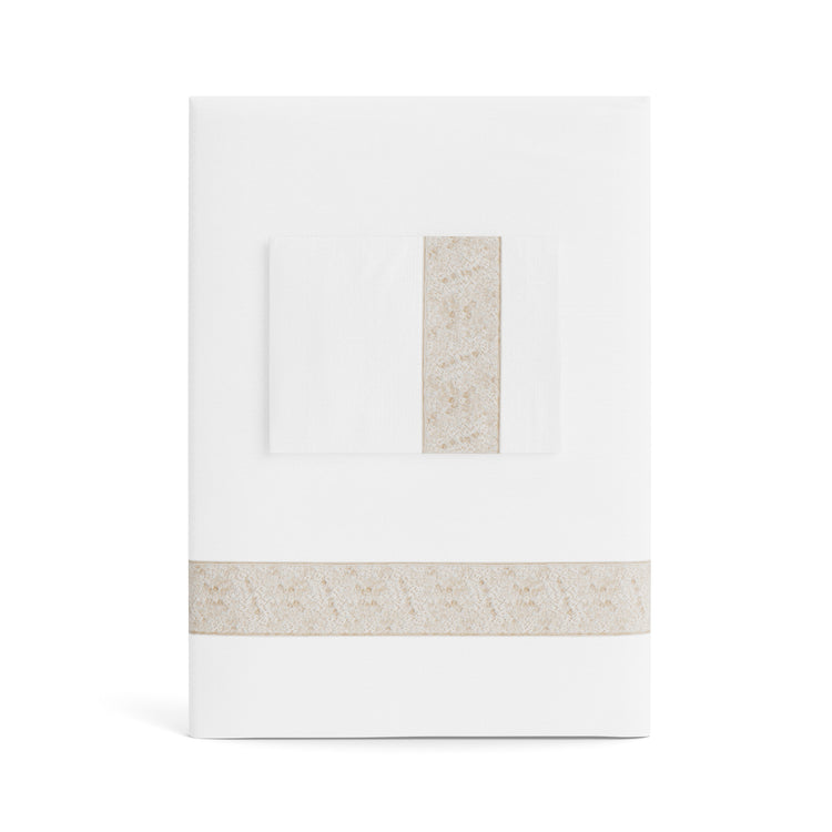 A folded white Minaudiere Sheet Set by Judith Leiber Couture x Ann Gish, shown with its matching pillowcase on top, featuring a pumice-colored sequenced border band that mirrors the jeweled sparkle of the Minaudiere design. - SSMIK-WHI-PUM SSMIQ-WHI-PUM